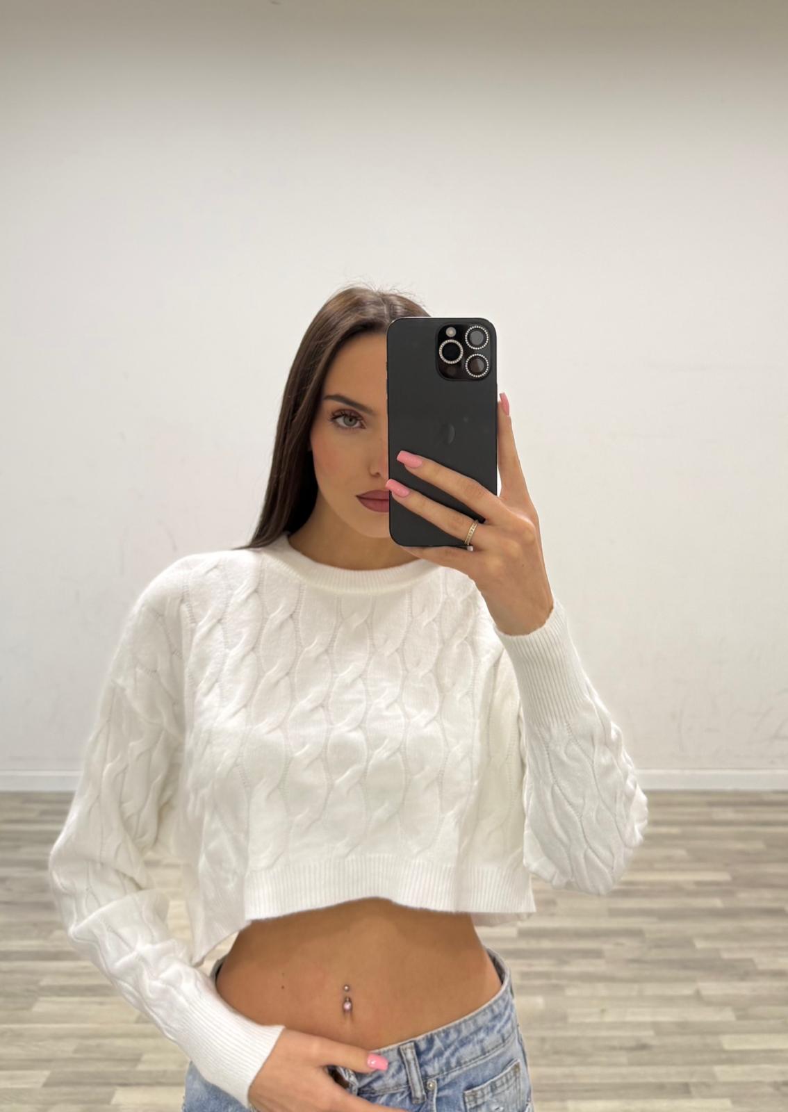 pull corto con treccie