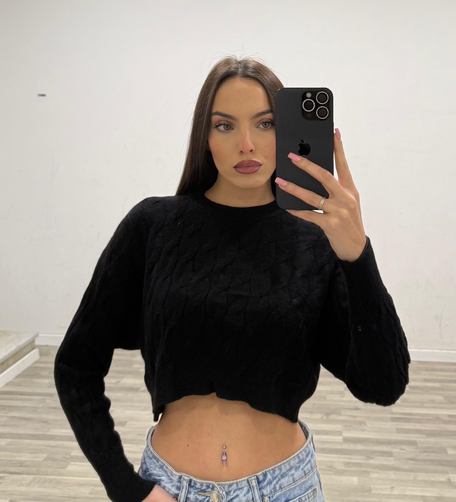 pull corto con treccie